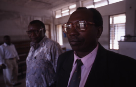     The rights and due process of Rwandan Hutus are systematically violated due to victor’s justice secured by the U.S., Europe, Israel and the proxy states Uganda, Tanzania and Rwanda. Bernard Ntuyahaga, a Major of the former Rwandan army (ex-FAR) accused of killing 10 Belgian soldiers and Prime Minister Agathe Uwilingiyimana, surrendered to the ICTR to avoid extradition to Rwanda; he was tried in Belgium and sentenced to 20 years in prison on July 4, 2007. Photo keith harmon snow, Tanzania, 2000.