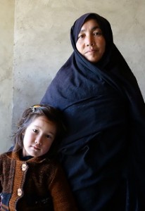 Safeh Zakira stands with her youngest daughter, age 5.